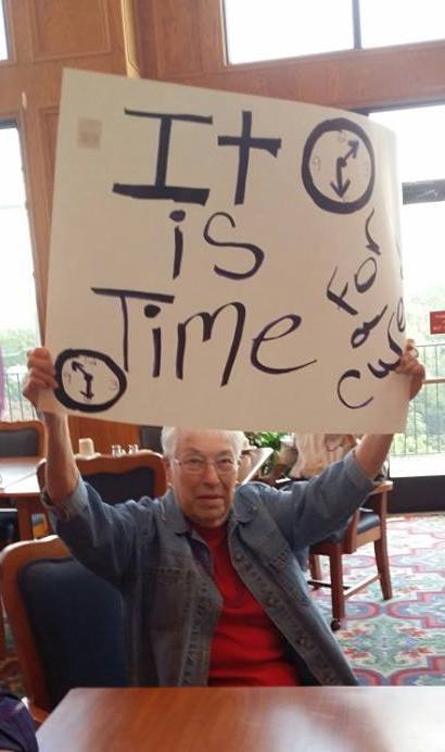 Resident holds Alzheimer's sign