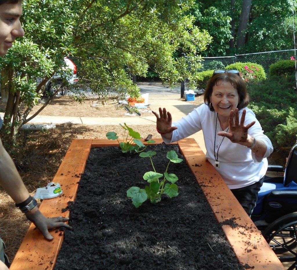 Image of resident working in community garden
