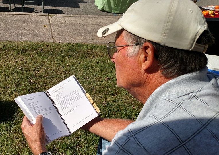 Assisted living resident reading outside