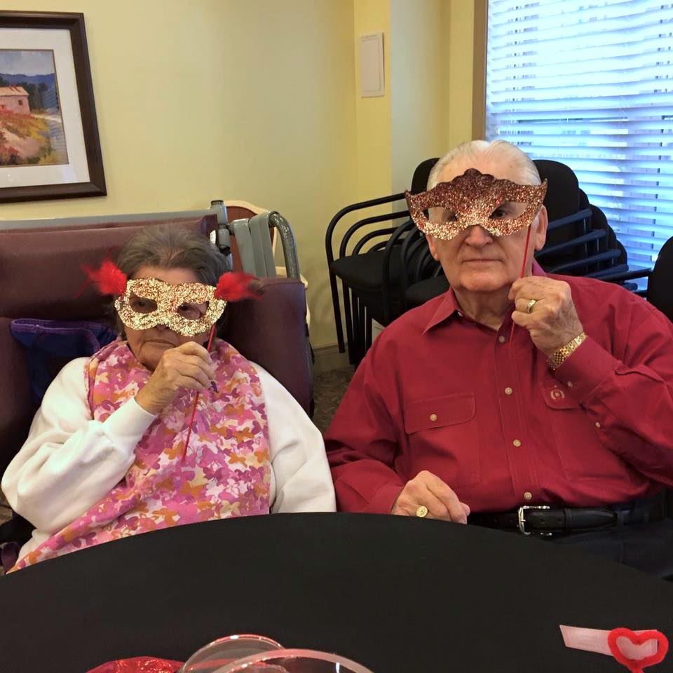 Residents with masquerade masks at Hope Memory Care senior living in Dacula, Georgia